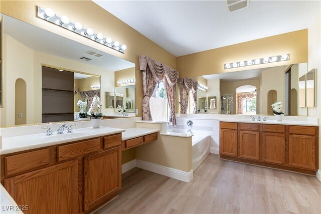 812 Eaglewood Dr, Las Vegas, NV 89144 - full bath with wood finished floors, vanity, a bath, and a closet