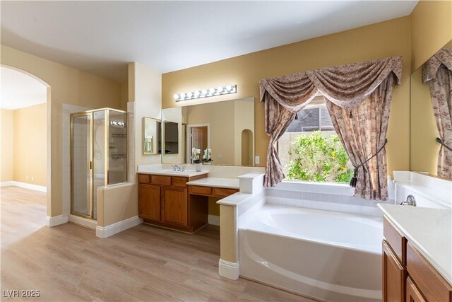 812 Eaglewood Dr, Las Vegas, NV 89144 - bathroom with a shower stall, vanity, a garden tub, and wood finished floors