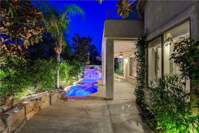 812 Eaglewood Dr, Las Vegas, NV 89144 - patio at night featuring a ceiling fan and a patio area
