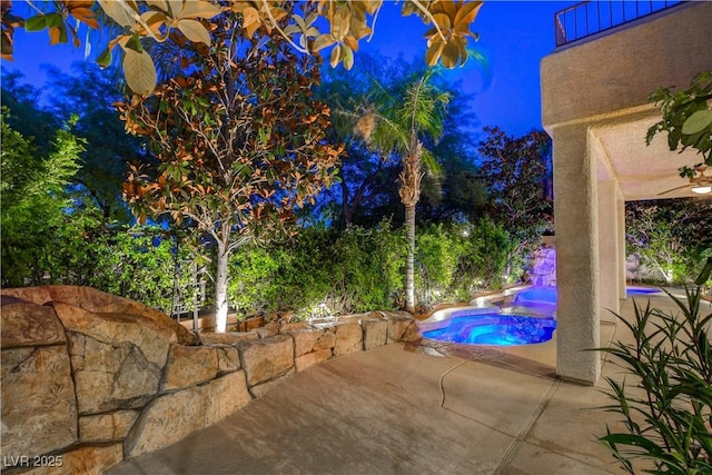812 Eaglewood Dr, Las Vegas, NV 89144 - pool at twilight with an in-ground hot tub, a patio, and an outdoor pool