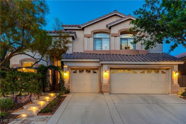 812 Eaglewood Dr, Las Vegas, NV 89144 - mediterranean / spanish-style house with a tiled roof, concrete driveway, stucco siding, and a garage