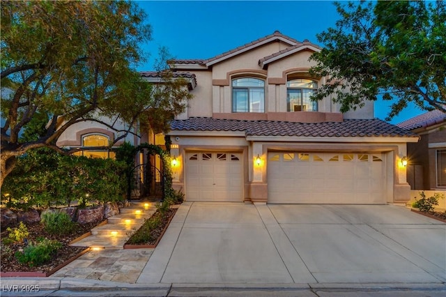 812 Eaglewood Dr, Las Vegas, NV 89144 - mediterranean / spanish-style house with stucco siding, concrete driveway, a tiled roof, and an attached garage