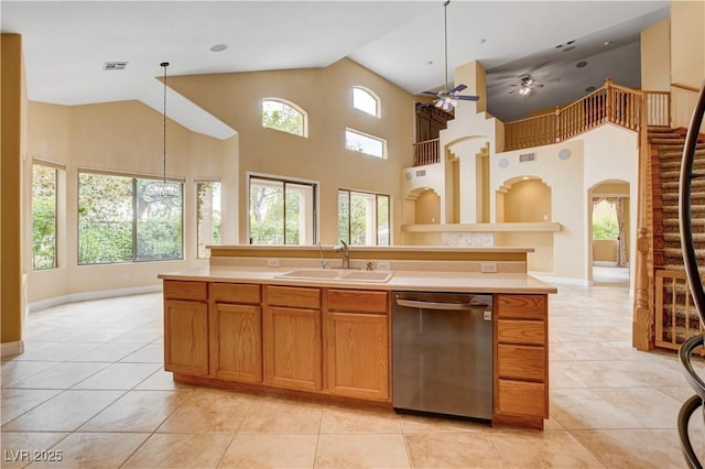 812 Eaglewood Dr, Las Vegas, NV 89144 - kitchen with stainless steel dishwasher, a high ceiling, a ceiling fan, light countertops, and light tile patterned floors