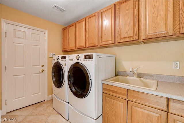 812 Eaglewood Dr, Las Vegas, NV 89144 - laundry room with cabinet space, washing machine and dryer, and light tile patterned flooring