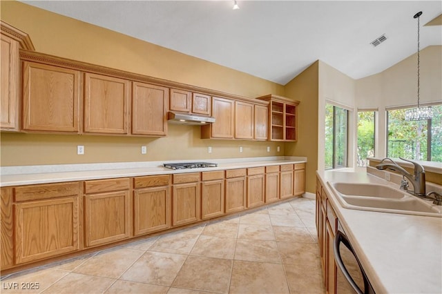 812 Eaglewood Dr, Las Vegas, NV 89144 - kitchen with under cabinet range hood, lofted ceiling, open shelves, light countertops, and stainless steel gas stovetop