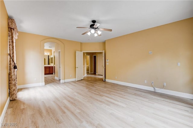 812 Eaglewood Dr, Las Vegas, NV 89144 - unfurnished room featuring ceiling fan, light wood finished floors, and arched walkways