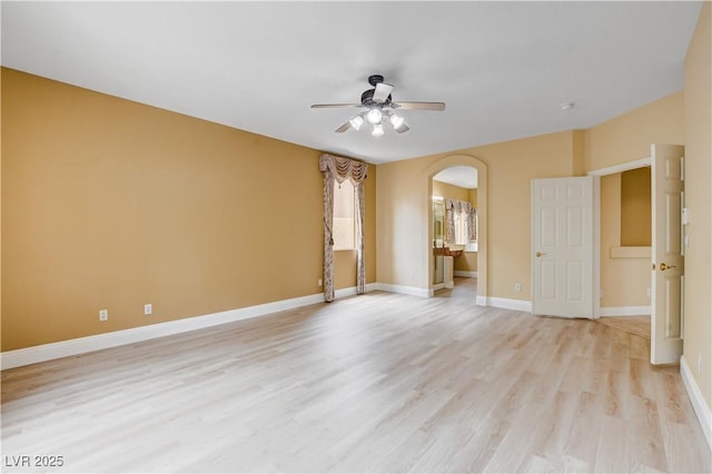 812 Eaglewood Dr, Las Vegas, NV 89144 - spare room featuring a ceiling fan, arched walkways, and light wood finished floors