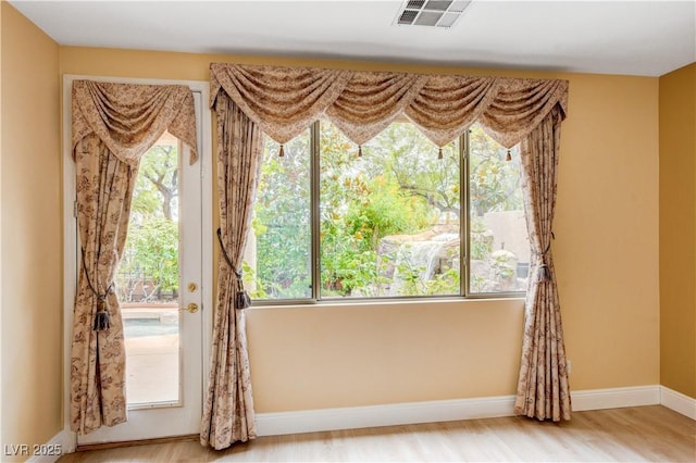 812 Eaglewood Dr, Las Vegas, NV 89144 - empty room featuring healthy amount of natural light and wood finished floors