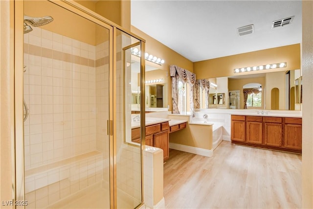 812 Eaglewood Dr, Las Vegas, NV 89144 - full bathroom with a shower stall, wood finished floors, a bath, and vanity