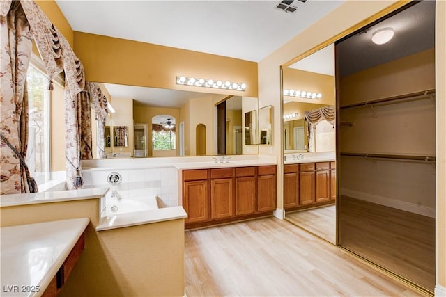 812 Eaglewood Dr, Las Vegas, NV 89144 - full bathroom featuring wood finished floors, vanity, and healthy amount of natural light
