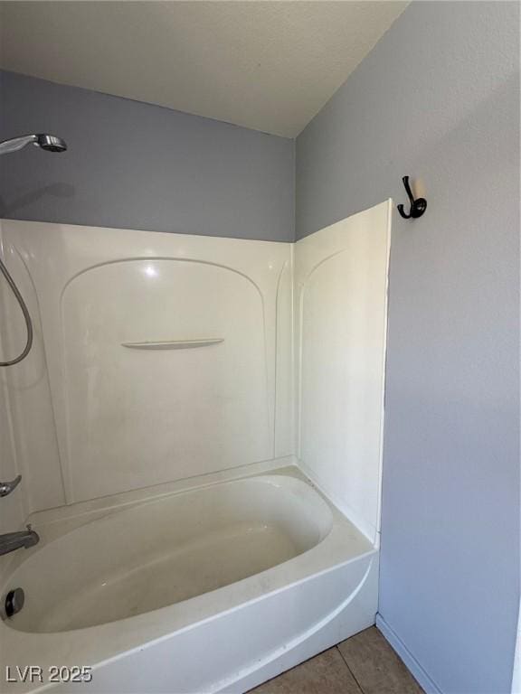 8089 Windmill Villa St, Las Vegas, NV 89139 - bathroom with tile patterned flooring and washtub / shower combination