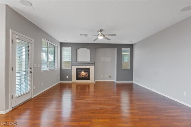 640 Finch Island Ave, Henderson, NV 89015 - unfurnished living room featuring baseboards, ceiling fan, visible vents, and wood finished floors