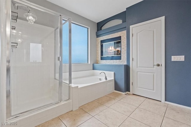 640 Finch Island Ave, Henderson, NV 89015 - bathroom featuring tile patterned flooring, a garden tub, baseboards, and a stall shower
