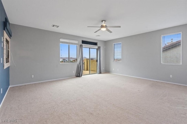640 Finch Island Ave, Henderson, NV 89015 - carpeted spare room featuring baseboards, plenty of natural light, and a ceiling fan