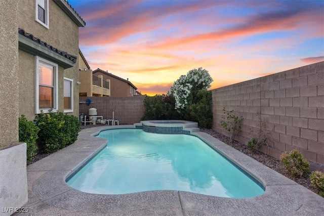 640 Finch Island Ave, Henderson, NV 89015 - view of pool featuring a patio, a pool with connected hot tub, and a fenced backyard