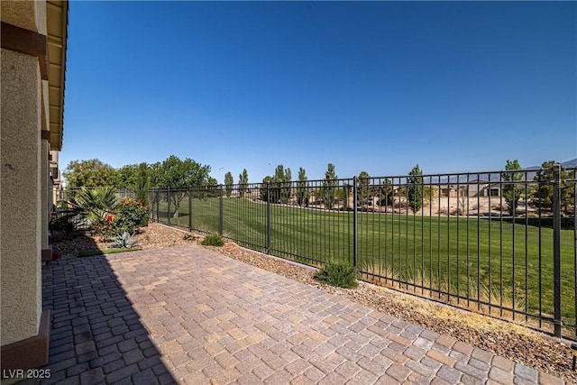 view of patio featuring fence
