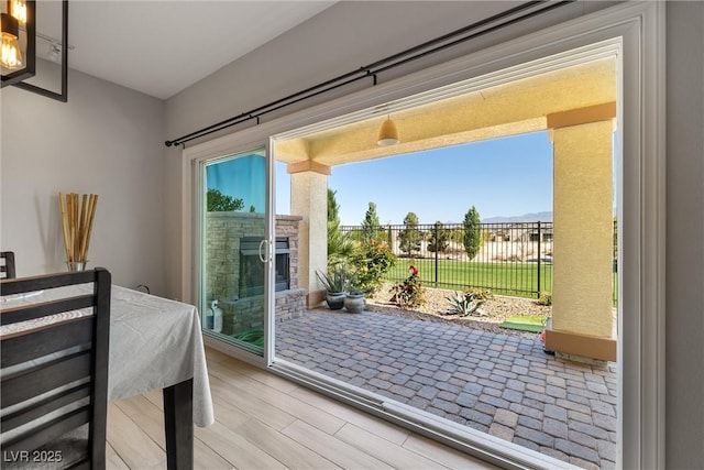 doorway to outside featuring an outdoor stone fireplace