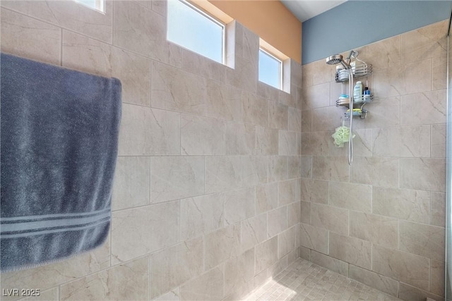 bathroom featuring tiled shower