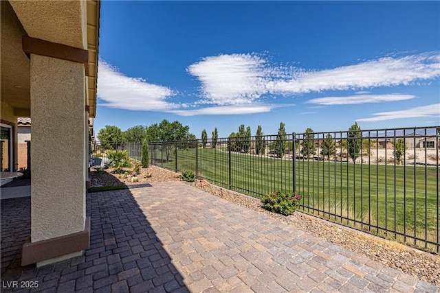 view of patio featuring fence