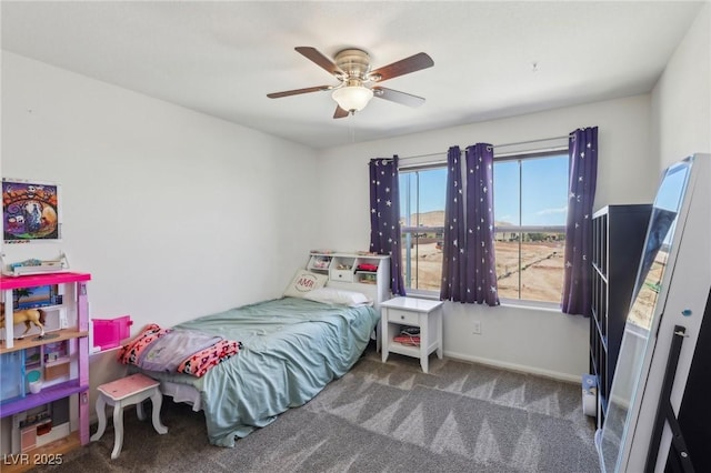 bedroom featuring baseboards, a ceiling fan, and carpet