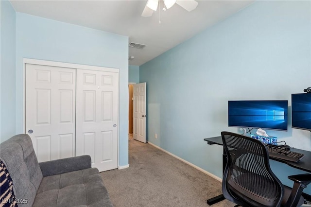 carpeted office space with ceiling fan, baseboards, and visible vents
