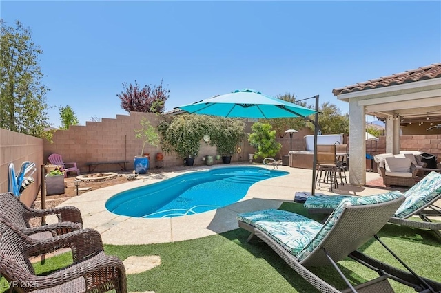 view of swimming pool featuring outdoor dry bar, a patio, a fire pit, and a fenced backyard