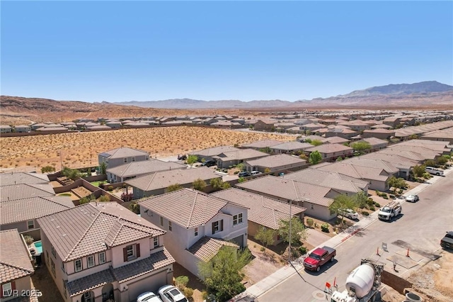 drone / aerial view with a residential view and a mountain view