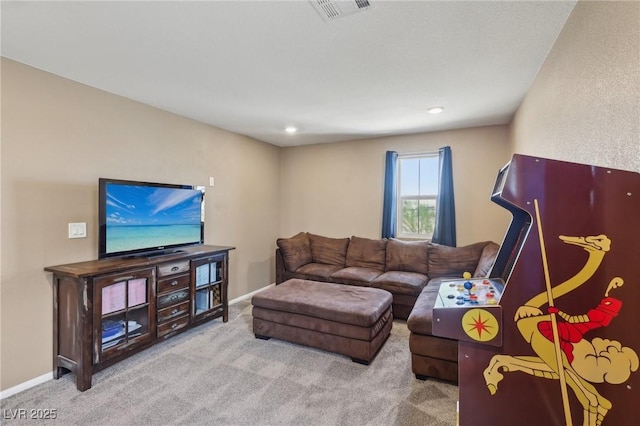 living room with carpet, visible vents, and baseboards