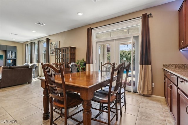dining room with light tile patterned floors, visible vents, french doors, and recessed lighting