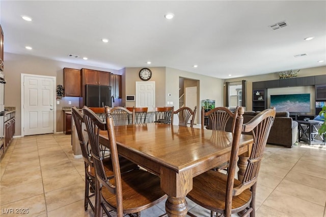 dining area featuring light tile patterned floors, recessed lighting, and visible vents