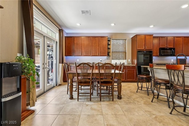 dining space featuring visible vents, light tile patterned floors, french doors, and recessed lighting