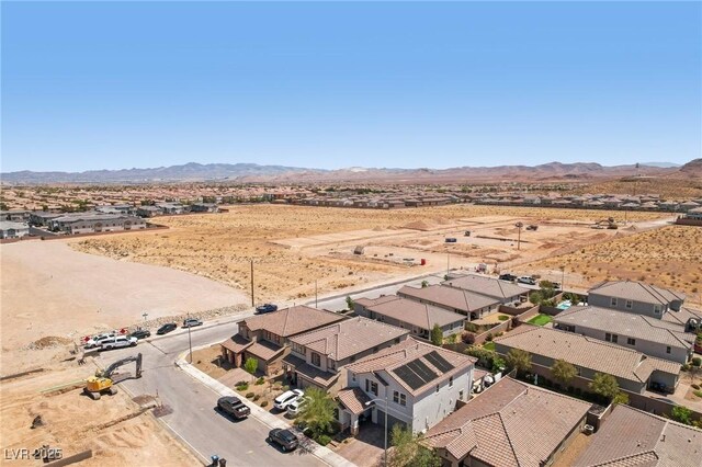 aerial view with a rural view, view of desert, a mountain view, and a residential view