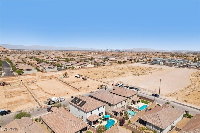 drone / aerial view featuring a mountain view and a residential view