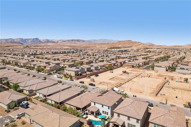 aerial view featuring a mountain view and a residential view