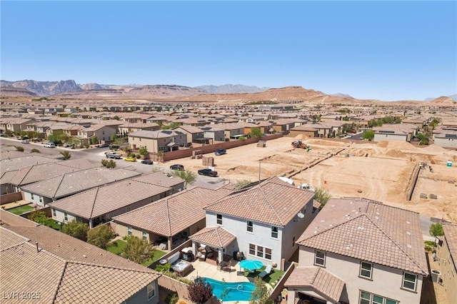 aerial view featuring a mountain view and a residential view