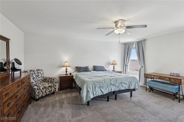 bedroom with ceiling fan and dark colored carpet