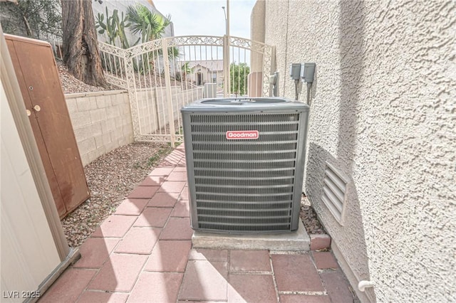 exterior details featuring fence and cooling unit