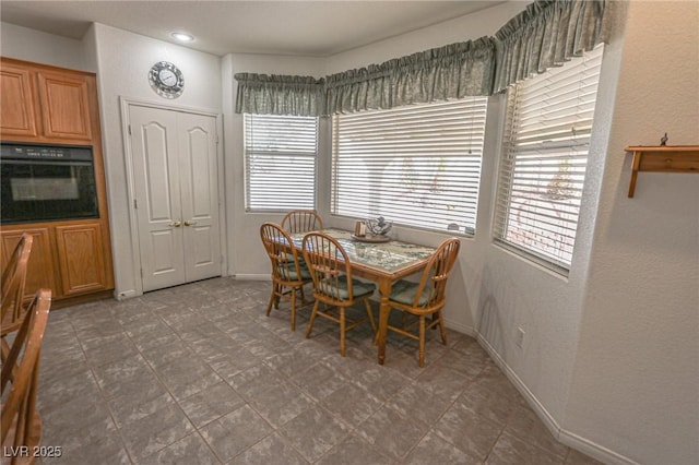 dining area with a wealth of natural light and baseboards