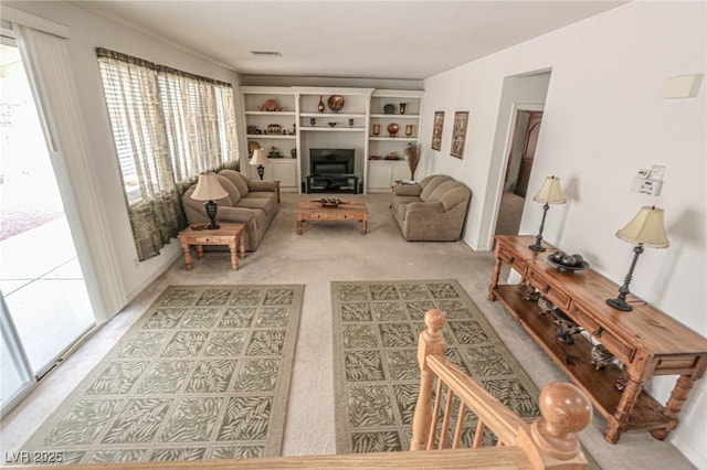 carpeted living area with visible vents