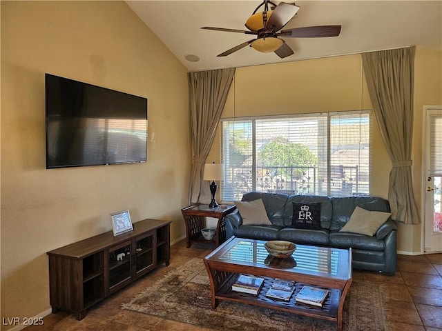 living area featuring vaulted ceiling, baseboards, and ceiling fan