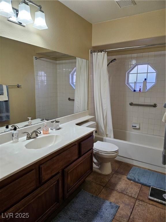 bathroom featuring visible vents, vanity, shower / bath combo, and toilet