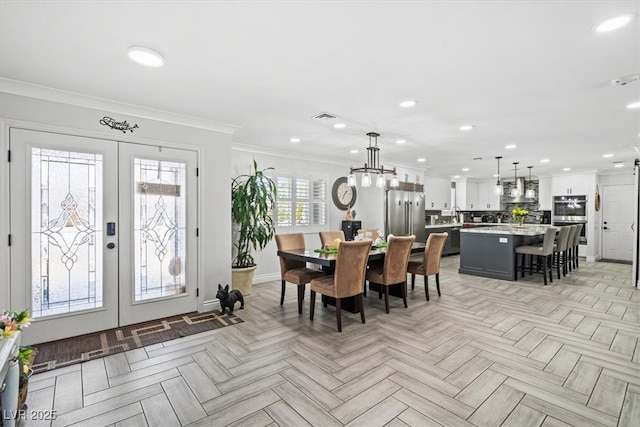 dining area featuring visible vents, ornamental molding, baseboards, recessed lighting, and french doors