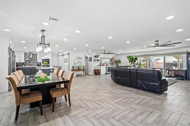 dining room featuring recessed lighting, visible vents, and ceiling fan with notable chandelier