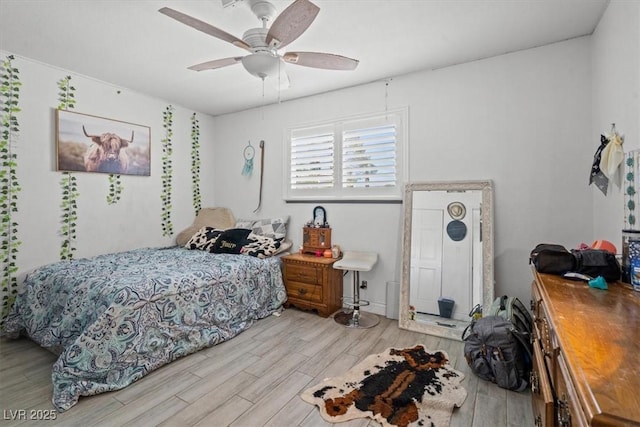 bedroom featuring ceiling fan and wood finished floors