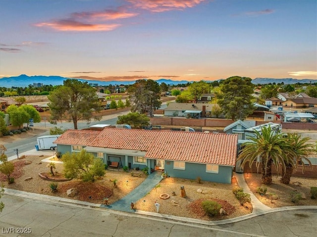 aerial view at dusk with a residential view and a mountain view