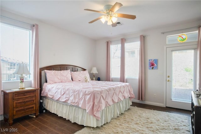 3491 Cottage Thistle Dr, Laughlin, NV 89029 - bedroom with visible vents, baseboards, ceiling fan, dark wood finished floors, and access to exterior