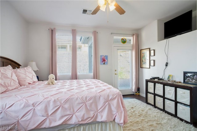 3491 Cottage Thistle Dr, Laughlin, NV 89029 - bedroom with multiple windows, a ceiling fan, access to outside, and visible vents