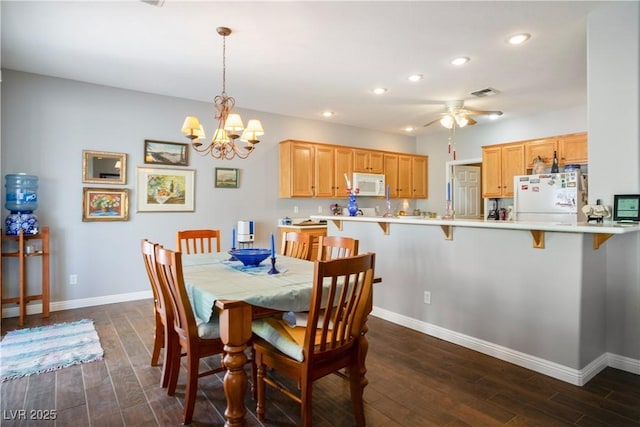 3491 Cottage Thistle Dr, Laughlin, NV 89029 - dining space with dark wood finished floors, baseboards, ceiling fan with notable chandelier, visible vents, and recessed lighting