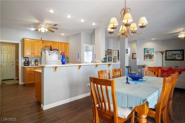 3491 Cottage Thistle Dr, Laughlin, NV 89029 - dining area featuring visible vents, baseboards, recessed lighting, ceiling fan with notable chandelier, and dark wood-style floors