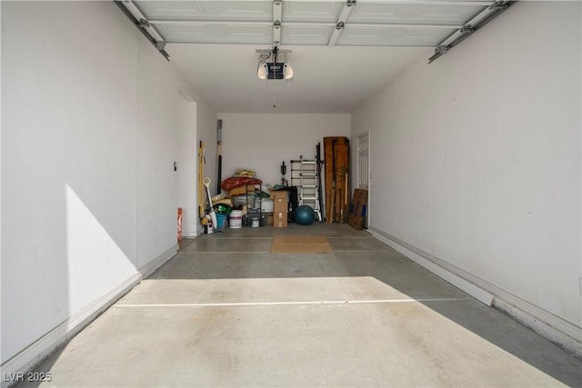 3491 Cottage Thistle Dr, Laughlin, NV 89029 - garage featuring baseboards and a garage door opener